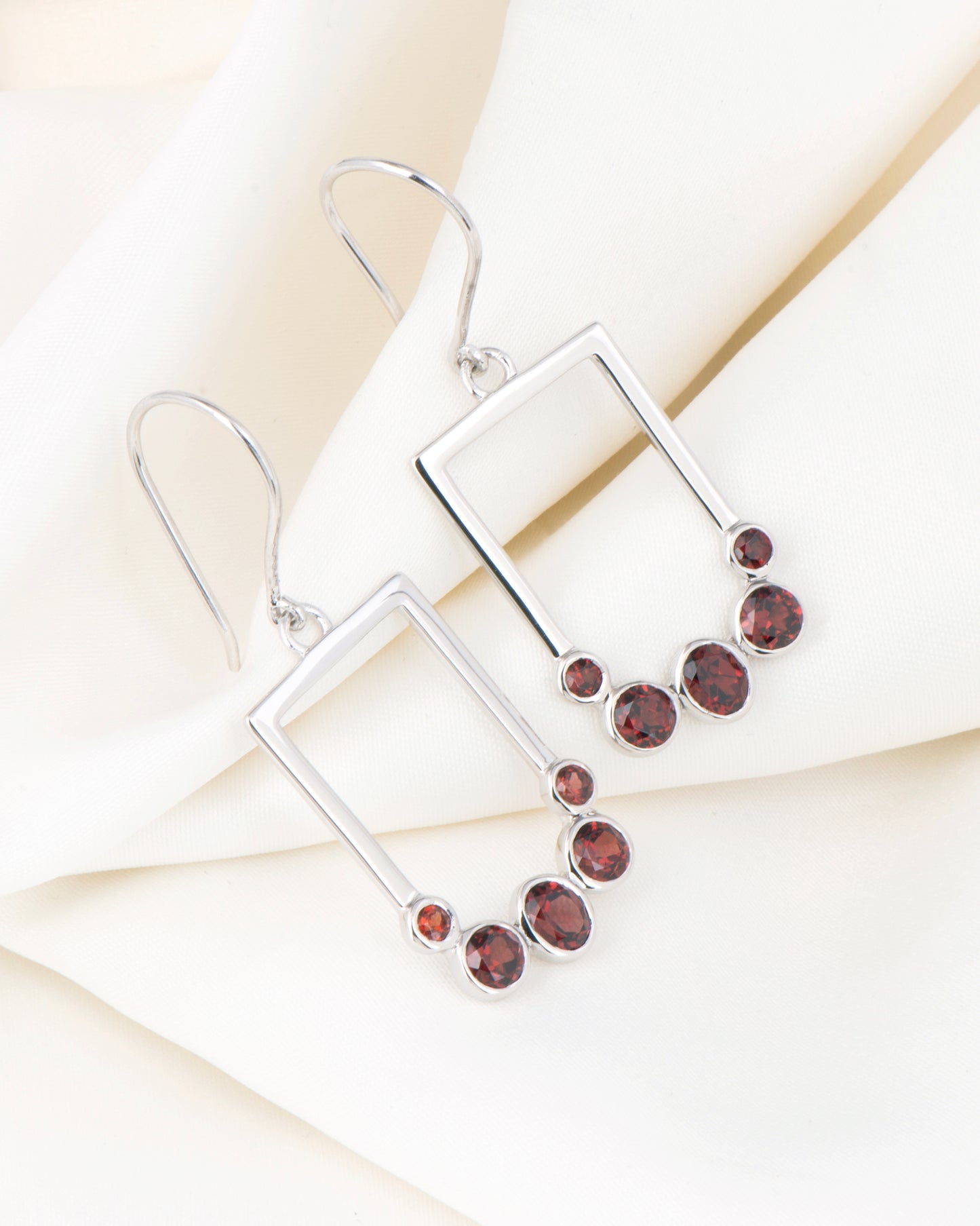 Verdant Currents Swirl Beneath Earrings